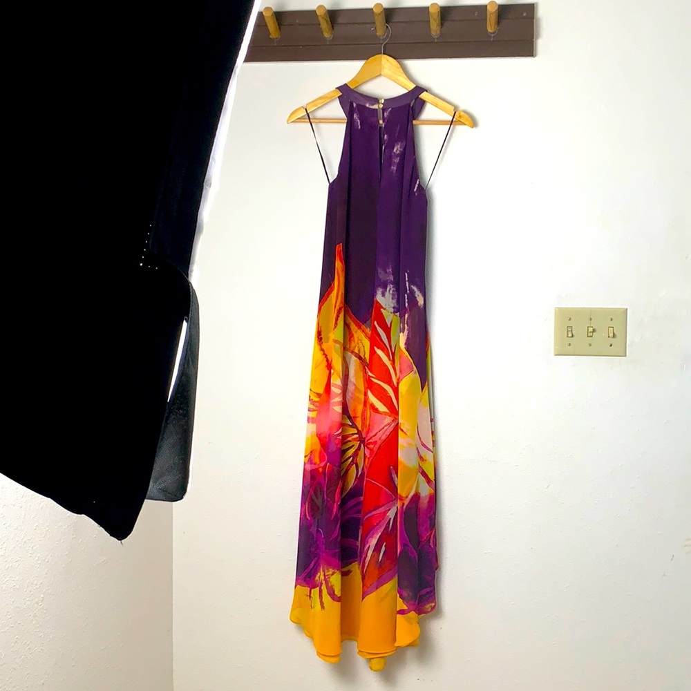 Shoulder less dress that has hanker-chief hemline